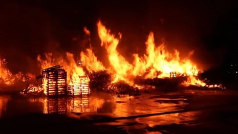 Fire crews respond to blaze at pallet yard in Sydney's south-west – video