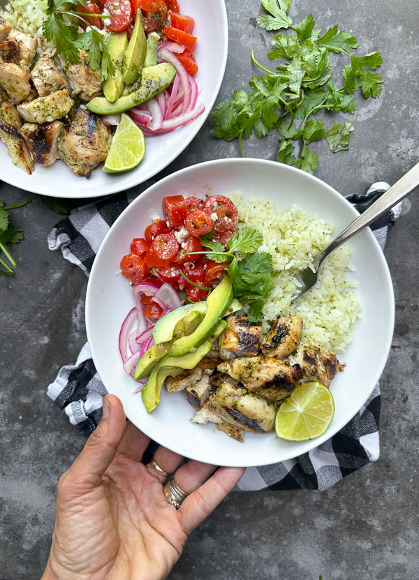 Fresh, zesty, and perfect for meal prep, these Cilantro Lime Chicken Bowls from Jessica Merchant's Easy Everyday Cookbook are a weeknight game-changer! Packed with flavor, easy to assemble, and great for leftovers. Save this one!
