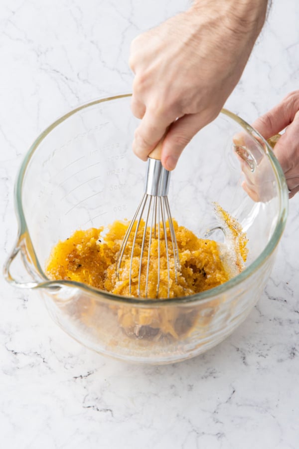 Whisking egg yolks with sugar and spices, at first it will be dark yellow and paste-like.
